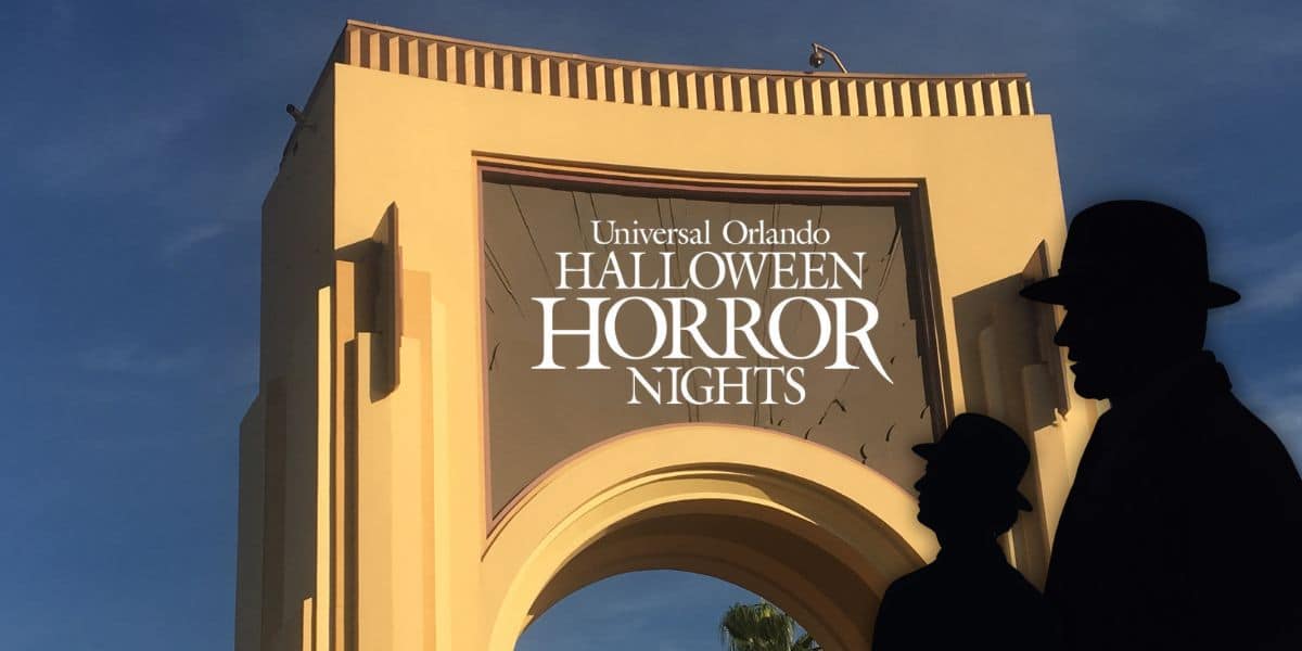 Universal Orlando’s iconic archway decked out for Halloween Horror Nights, with two mysterious hats in silhouette. Halloween Horror Nights haunted house.