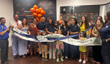 Empire Pros Roofing founder and CEO Ricardo Lopez Sandoval cuts the ribbon during the company’s renovation celebration Friday, July 17, at its Apopka office, surrounded by employees, family members and Apopka Area Chamber of Commerce representatives.