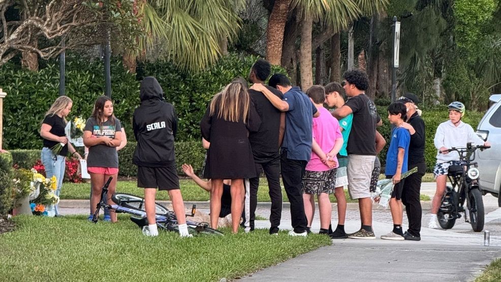 Coaches, friends, and family gathered March 14, to honor the boy's memory at a makeshift memorial decorated with flowers and heartfelt messages. His coaches identified the boy as Rico Roundtree, a Jupiter Middle School student. (WPEC)