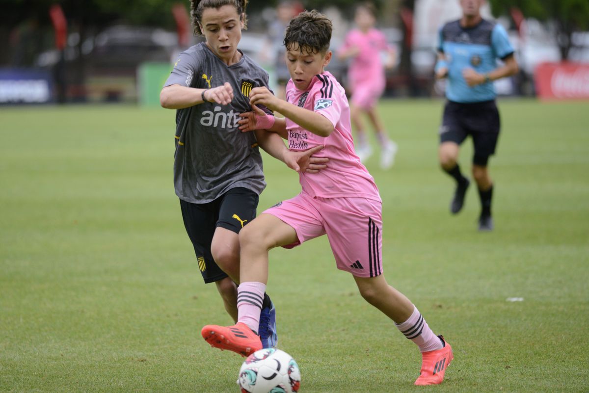 Benjamin Suarez (r), son of professional soccer player Luis Suarez, plays with the Inter Miami team