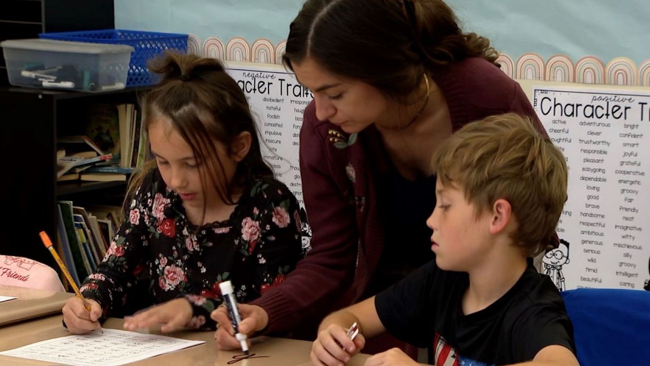 Third-graders at Rymfire Elementary in Flagler schools are learning to read and write in cursive. (Arnie Gerard/Spectrum News)