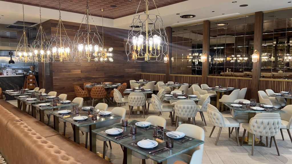 a dining room with tables and lights