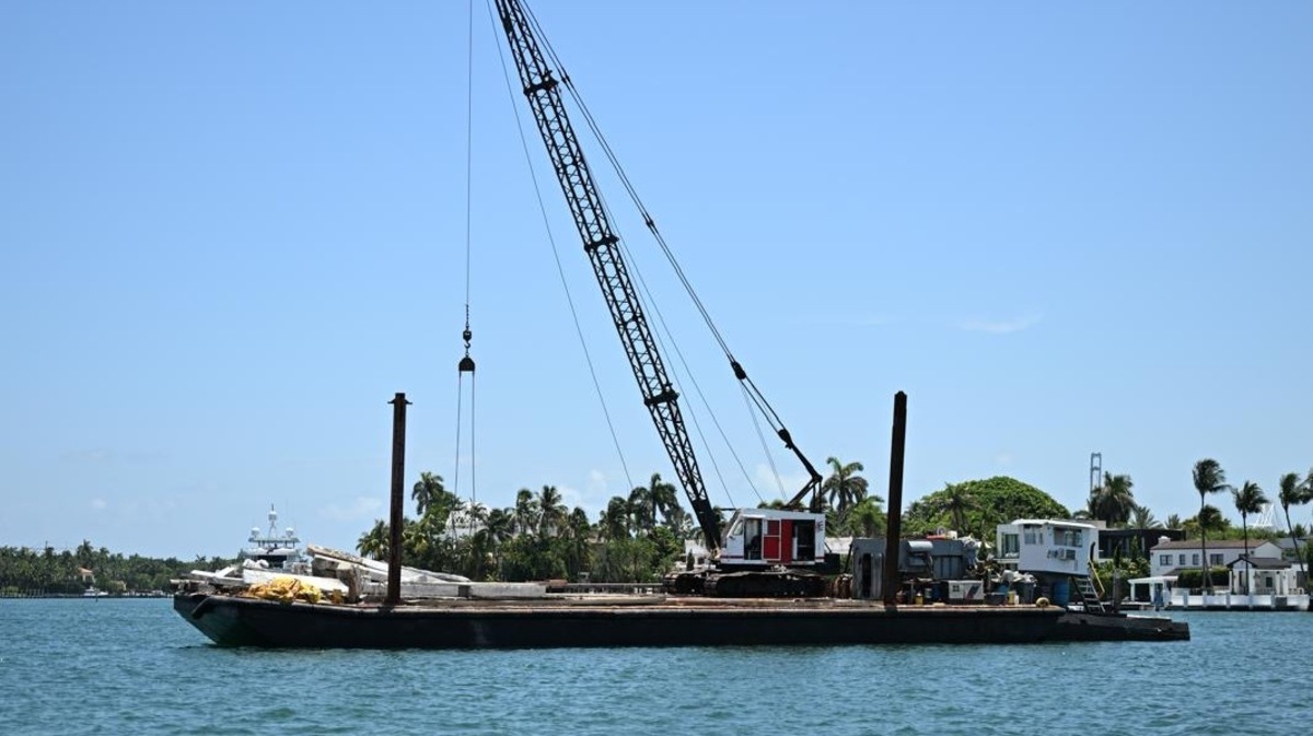 A barge floats off Hibiscus Island near Miami Beach on Monday, July 28, 2025. The vessel struck a sailboat earlier in the day, killing three girls on the sailboat. A barge floats off Hibiscus Island near Miami Beach on Monday, July 28, 2025. The vessel struck a sailboat earlier in the day, killing three girls on the sailboat.