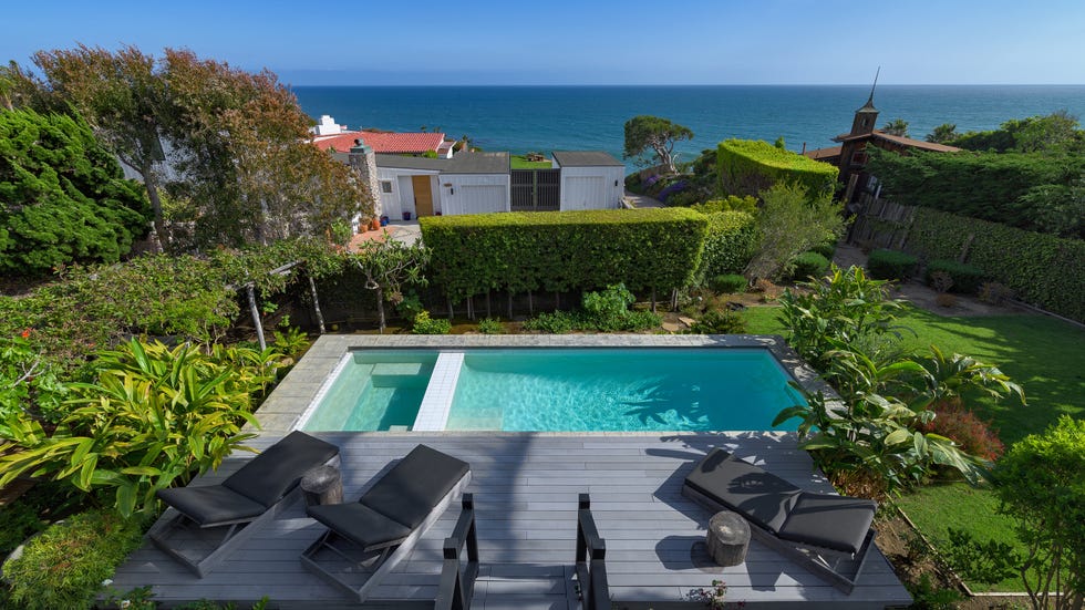 Coastal property with a pool and lush garden