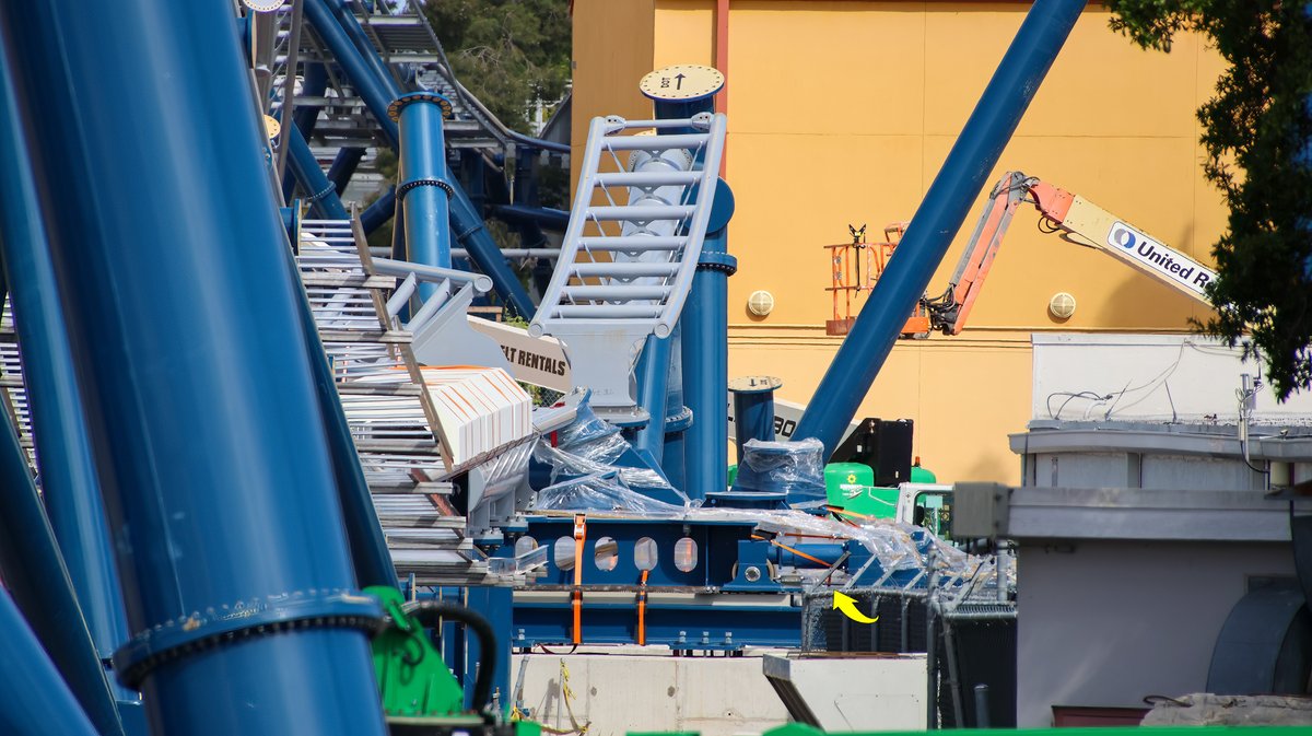 The arrow placed by bioreconstruct in the above photo points to the sliding switch track for the coaster's upwards spike. It is currently held down with a bright orange strap.