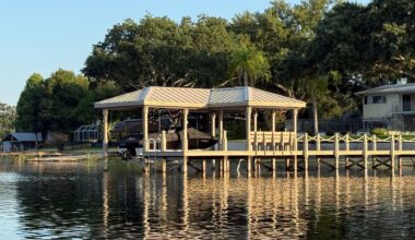 A covered boat dock is built along the shoreline of Little Conway Lake in Orange County.  The county is considering a plan to increase fees to build new docks and boat ramps. (Spectrum News)