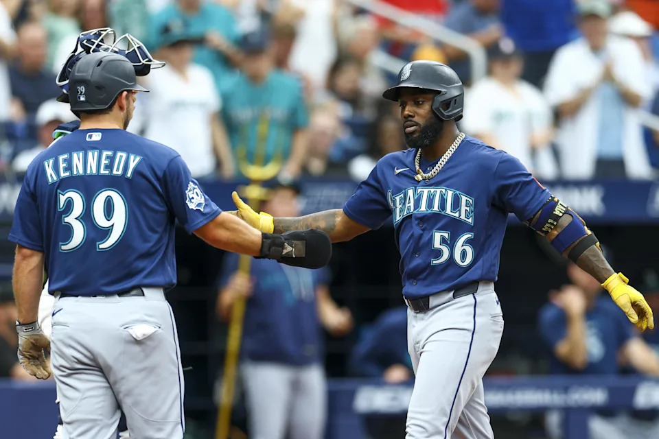 Jul 12, 2026; St. Petersburg, Florida, USA; <a class="link " href="https://sports.yahoo.com/mlb/teams/seattle/" data-i13n="sec:content-canvas;subsec:anchor_text;elm:context_link" data-ylk="slk:Seattle Mariners;sec:content-canvas;subsec:anchor_text;elm:context_link;itc:0" data-yga="{"yLinkElement":"context_link","yModuleName":"content-canvas","yLinkText":"Seattle Mariners","ySubModuleName":"anchor_text","yHasCommerce":false}">Seattle Mariners</a> left fielder <a class="link " href="https://sports.yahoo.com/mlb/players/11104/" data-i13n="sec:content-canvas;subsec:anchor_text;elm:context_link" data-ylk="slk:Randy Arozarena;sec:content-canvas;subsec:anchor_text;elm:context_link;itc:0" data-yga="{"yLinkElement":"context_link","yModuleName":"content-canvas","yLinkText":"Randy Arozarena","ySubModuleName":"anchor_text","yHasCommerce":false}">Randy Arozarena</a> (56) greets third baseman <a class="link " href="https://sports.yahoo.com/mlb/players/12641/" data-i13n="sec:content-canvas;subsec:anchor_text;elm:context_link" data-ylk="slk:Buddy Kennedy;sec:content-canvas;subsec:anchor_text;elm:context_link;itc:0" data-yga="{"yLinkElement":"context_link","yModuleName":"content-canvas","yLinkText":"Buddy Kennedy","ySubModuleName":"anchor_text","yHasCommerce":false}">Buddy Kennedy</a> (39) after hitting a three-run home run against the <a class="link " href="https://sports.yahoo.com/mlb/teams/tampa-bay/" data-i13n="sec:content-canvas;subsec:anchor_text;elm:context_link" data-ylk="slk:Tampa Bay Rays;sec:content-canvas;subsec:anchor_text;elm:context_link;itc:0" data-yga="{"yLinkElement":"context_link","yModuleName":"content-canvas","yLinkText":"Tampa Bay Rays","ySubModuleName":"anchor_text","yHasCommerce":false}">Tampa Bay Rays</a> in the fourth inning at Tropicana Field. Mandatory Credit: Nathan Ray Seebeck-Imagn Images | Nathan Ray Seebeck-Imagn Images