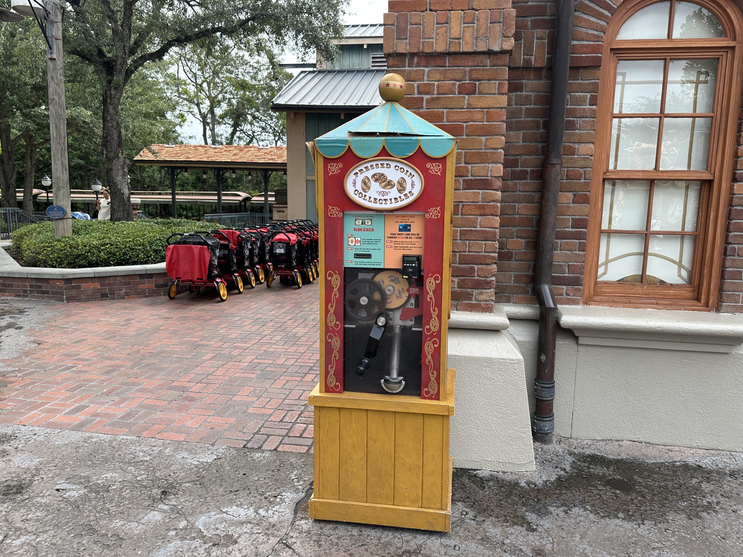 The wood-paneled collectible coin machine is falling apart. From seams coming undone to missing pieces of wood, the machine is quickly becoming a hazard in the area designed in part for some of the youngest guests at Walt Disney World.