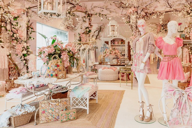 The interior of a flowery and pink retail store