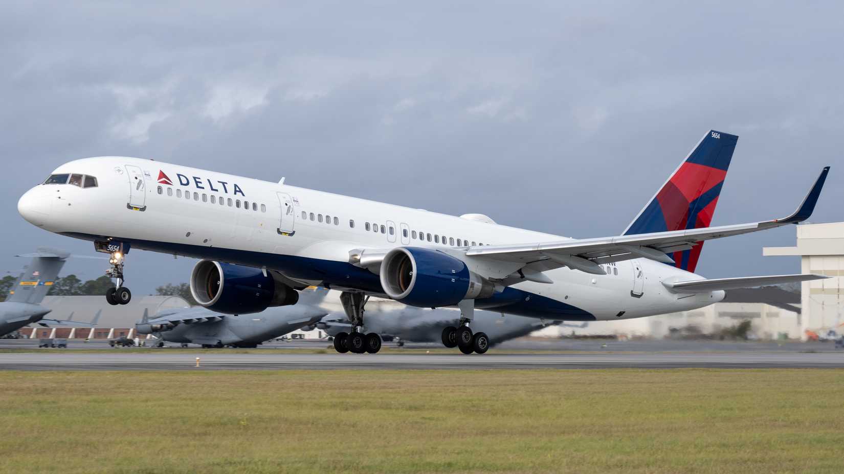 Delta Air Lines Boeing 757 airplane taking off from Charleston Airport