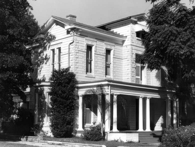 A black and white photo of a historic home in Tampa's Hyde Park neighborhood