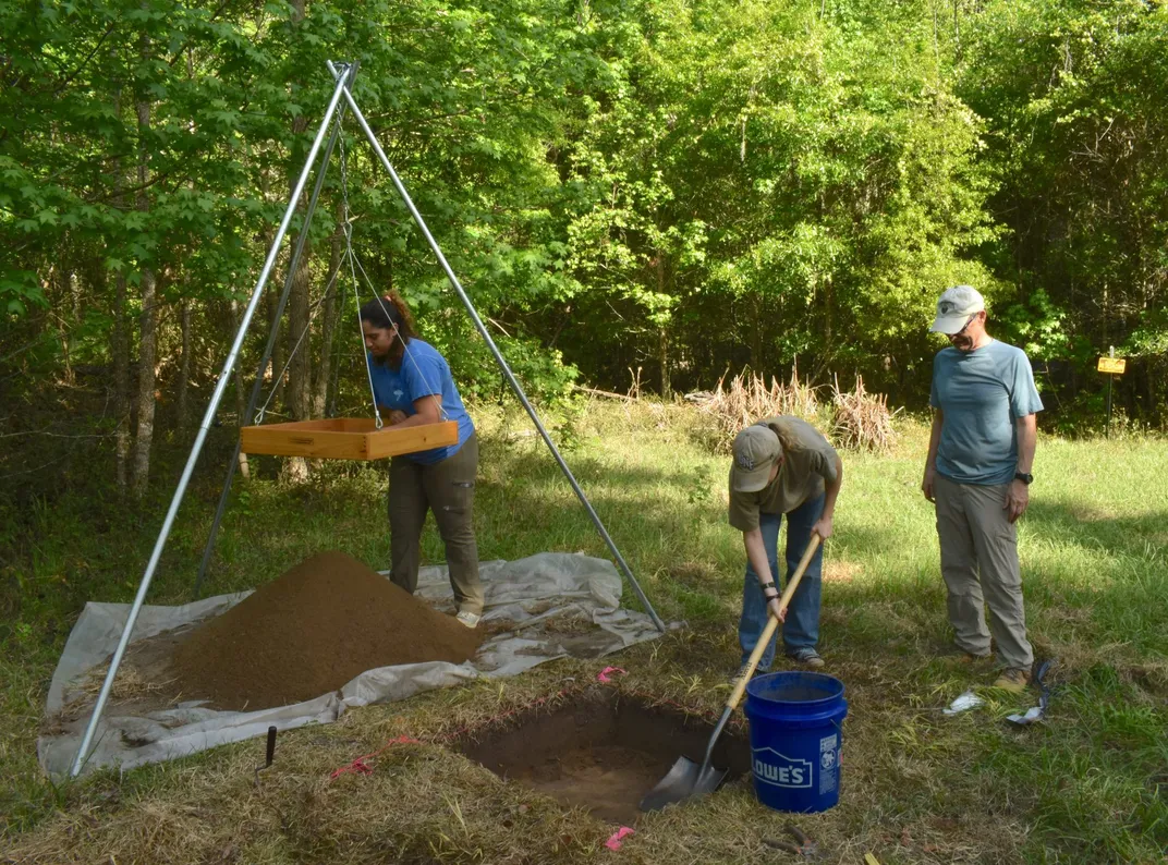 Archaeologists conducting an excavation