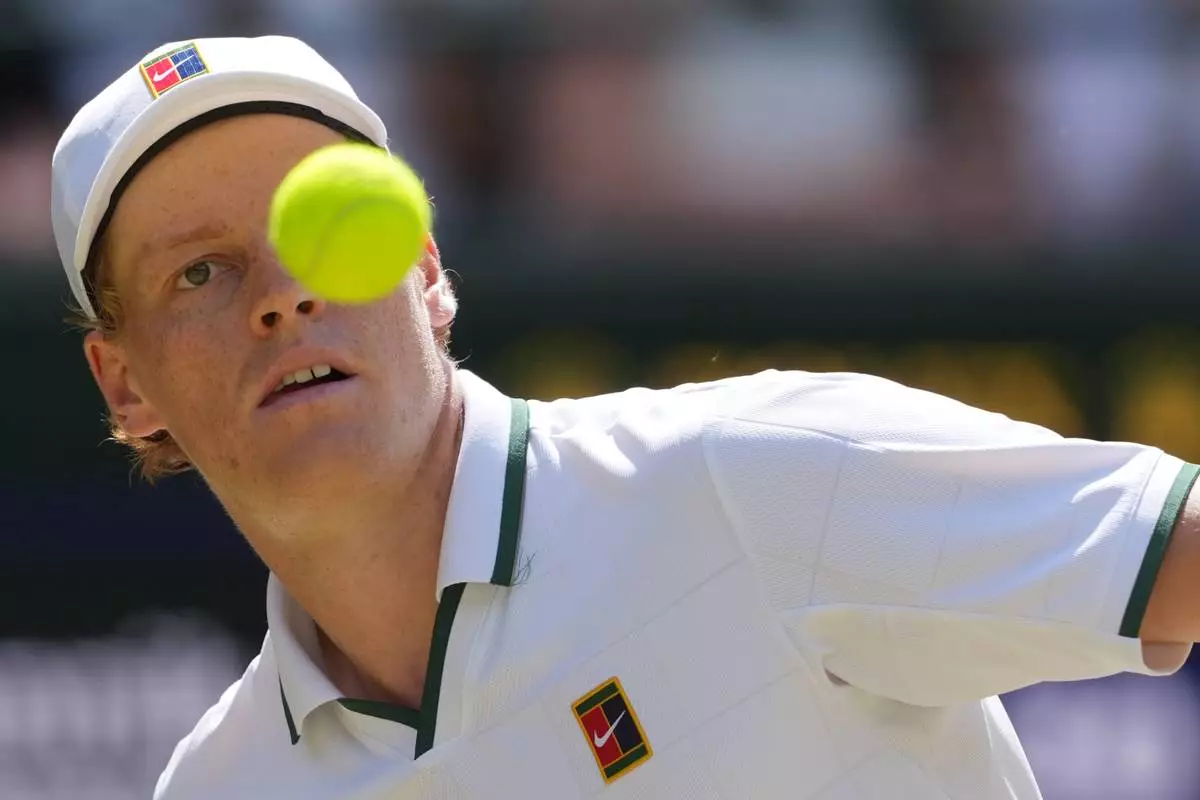 Jannik Sinner of Italy eyes the ball as he prepares to play a forehand against Jan-Lennard Struff of Germany in their quarter-final men's singles match at the Wimbledon Tennis Championships in London, Tuesday, July 7, 2026. (AP Photo/Kin Cheung)