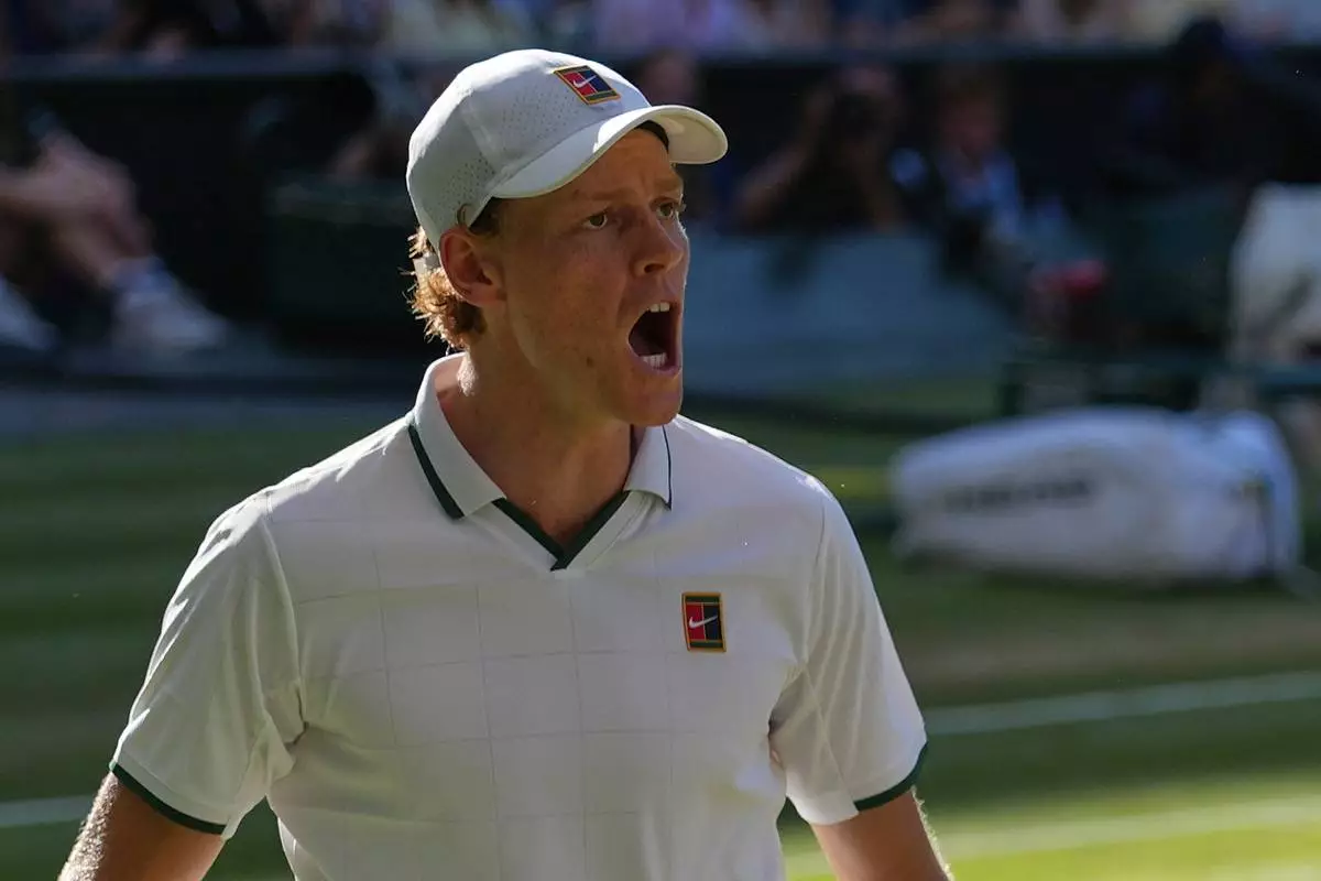 Jannik Sinner of Italy celebrates a point against Alexander Zverev of Germany in the men's singles final at Wimbledon Tennis Championships in London, Sunday, July 12, 2026. (AP Photo/Kirsty Wigglesworth)