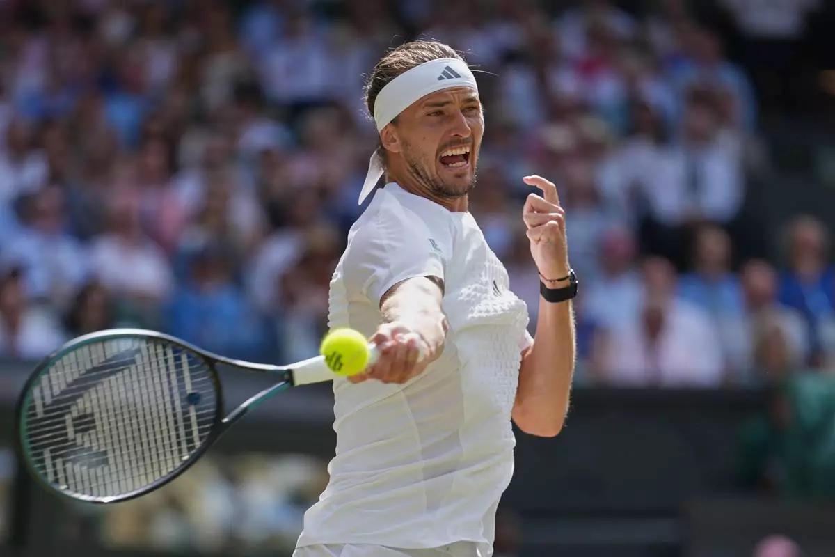 Alexander Zverev of Germany celebrates winning a point against Arthur Fery of Britain during their men's singles semifinal match at the Wimbledon Tennis Championships in London, Friday, July 10, 2026. (AP Photo/Kirsty Wigglesworth)
