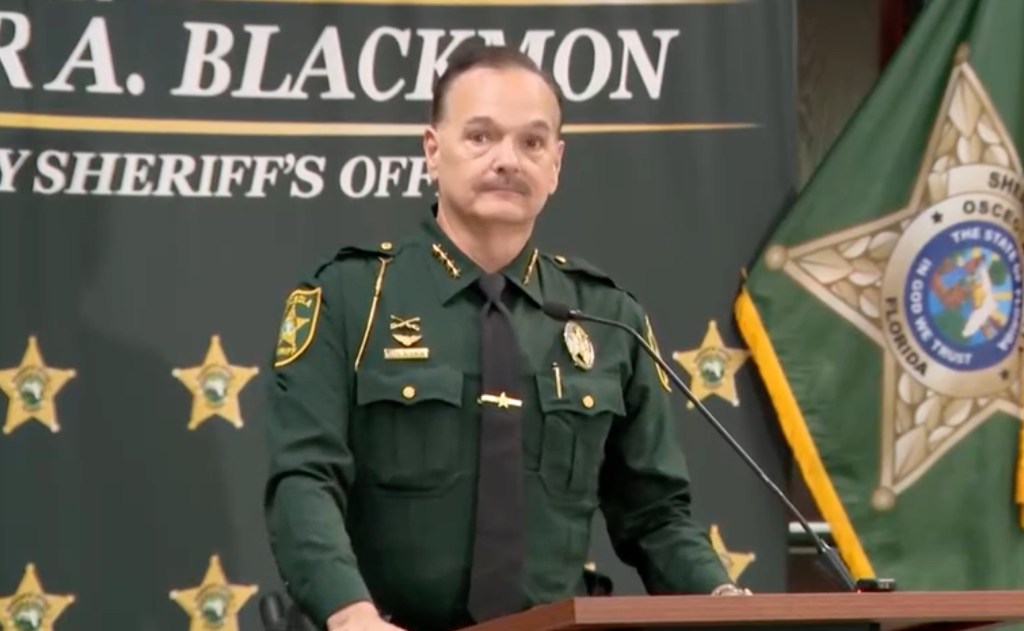 Osceola County Sheriff Christopher A. Blackmon speaks at a press conference.