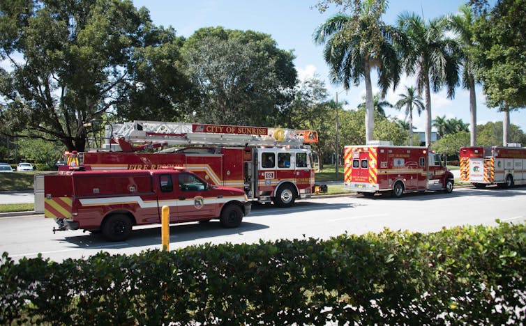 Fire trucks and an ambulance on their way to an emergency