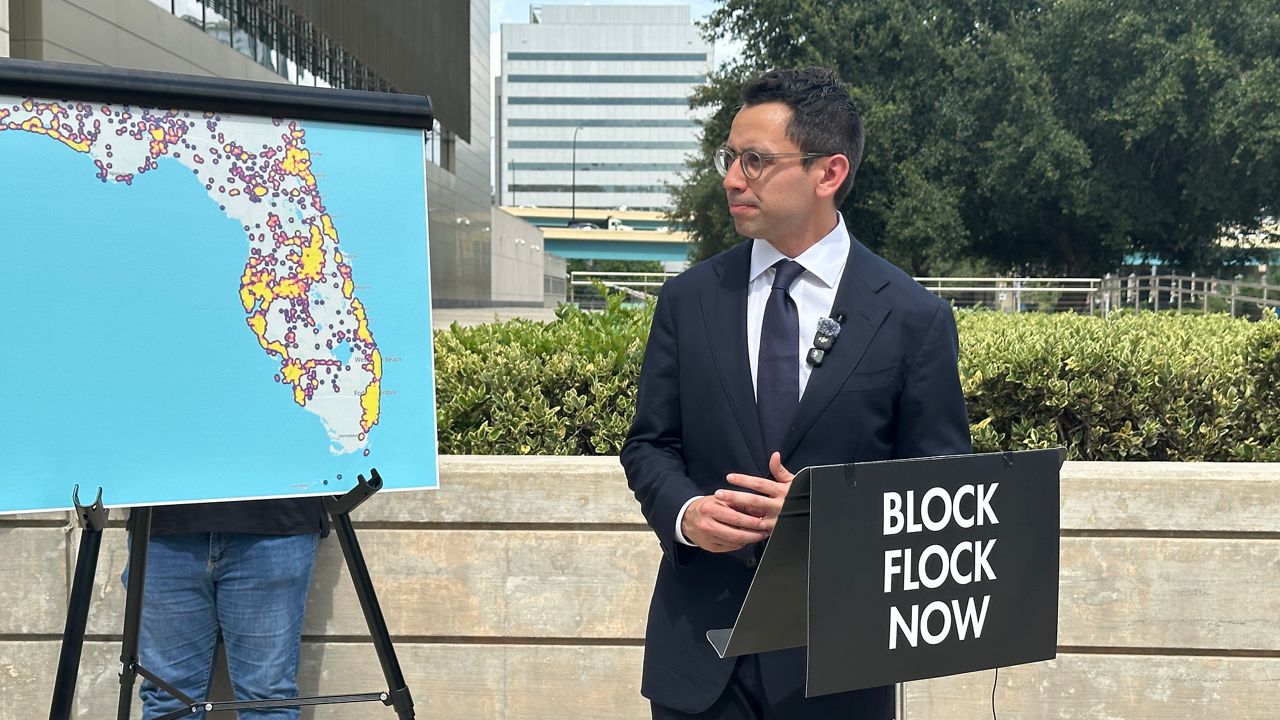 Republican gubernatorial candidate James Fishback calls for Flock surveillance cameras to be banned in Florida during a rally Tuesday outside the U.S. courthouse in Orlando. (Spectrum News)