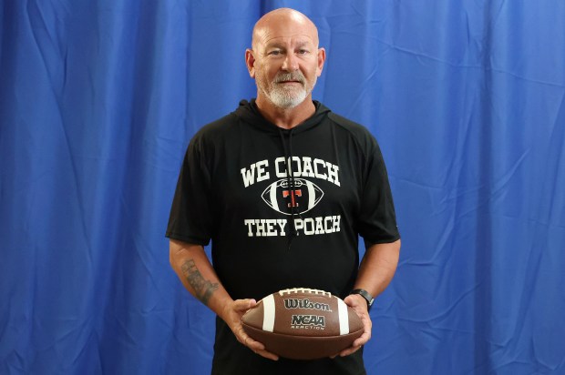 After he saw nearly 20 players transfer from his school this off season, Tavares High coach Gavin Jones decided to make a statement at the Central Florida Media Days in Lake Mary, sporting a T-shirt that read, 'We Coach, They Poach,' Thursday, July 23, 2026. (Stephen M. Dowell/Orlando Sentinel)