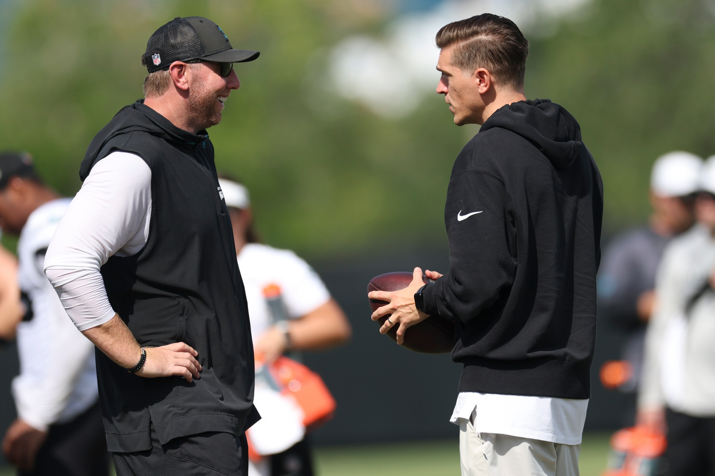 JACKSONVILLE, FLORIDA - AUGUST 5: Head coach Liam Coen and general manager James Gladstone of the Jacksonville Jaguars talk on the field during Training Camp at Miller Electric Center on August 5, 2025 in Jacksonville, Florida. (Photo by Logan Bowles/Getty Images)
