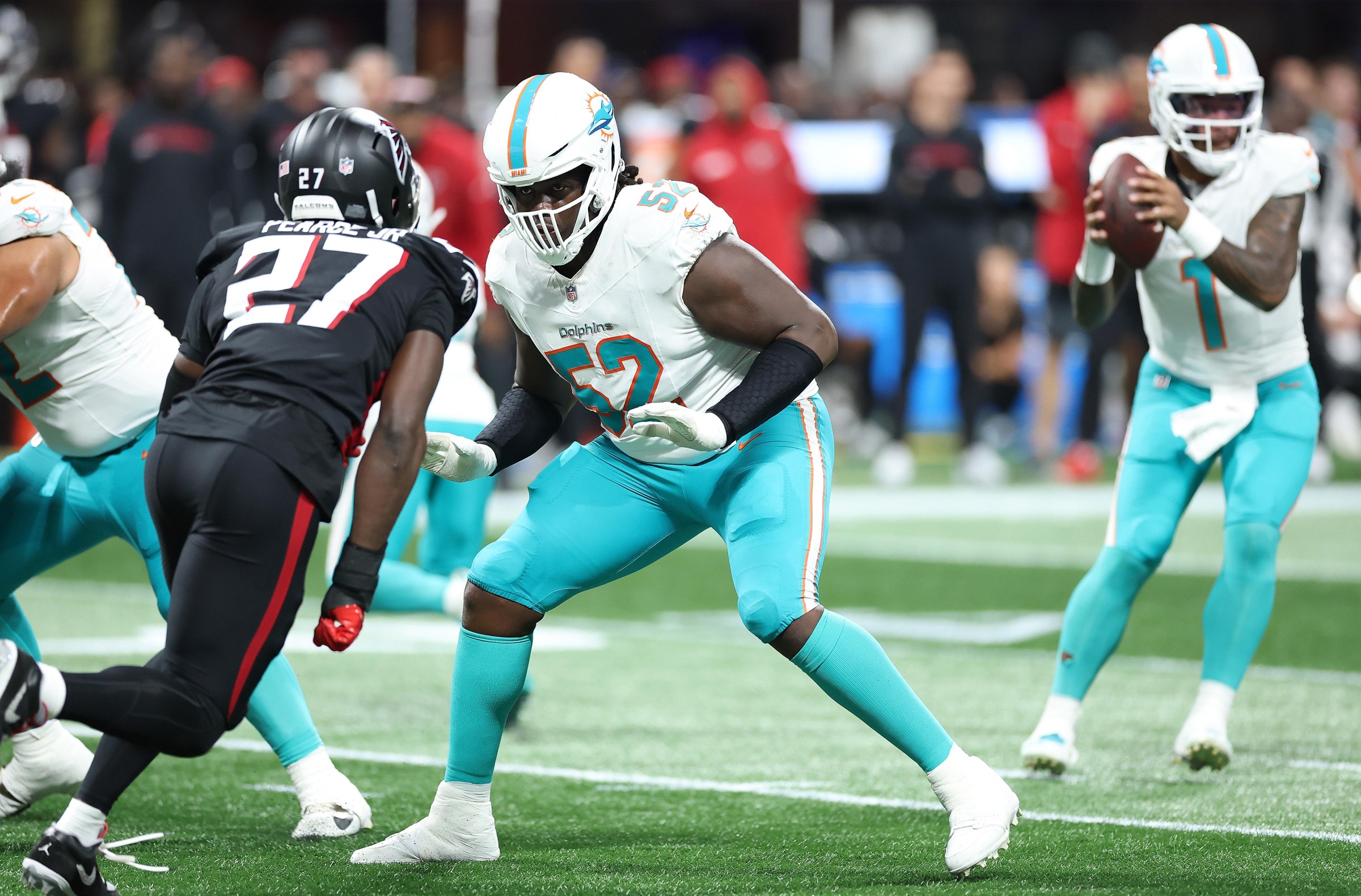 ATLANTA, GEORGIA - OCTOBER 26: Patrick Paul #52 of the Miami Dolphins blocks against James Pearce Jr. #27 of the Atlanta Falcons during the second quarter of the game between the Miami Dolphins and Atlanta Falcons at Mercedes-Benz Stadium on October 26, 2025 in Atlanta, Georgia. (Photo by Kevin C. Cox/Getty Images)