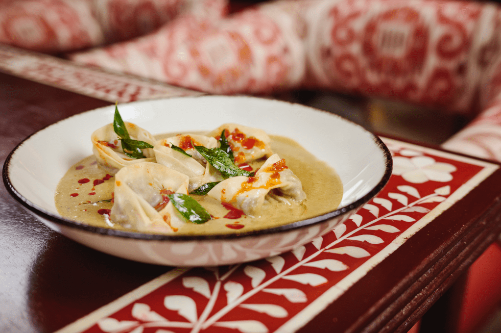 A dish from Ghee Indian Kitchen with yellow sauce 