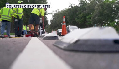 Crews place protective dividers along St. Petersburg bike lanes