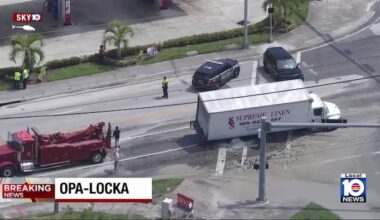 Semi-truck falls into sinkhole after water main break in Opa-locka