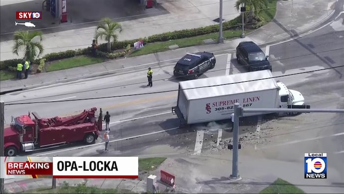 Semi-truck falls into sinkhole after water main break in Opa-locka