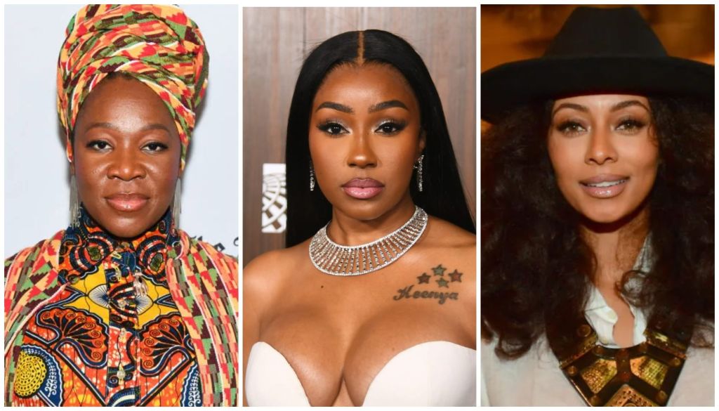 Three Black women in stylish outfits: a woman in a colorful headwrap, a woman with a diamond necklace and tattoo, and a woman in a cowboy hat.
india.arie x Yung Miami x Keri Hilson