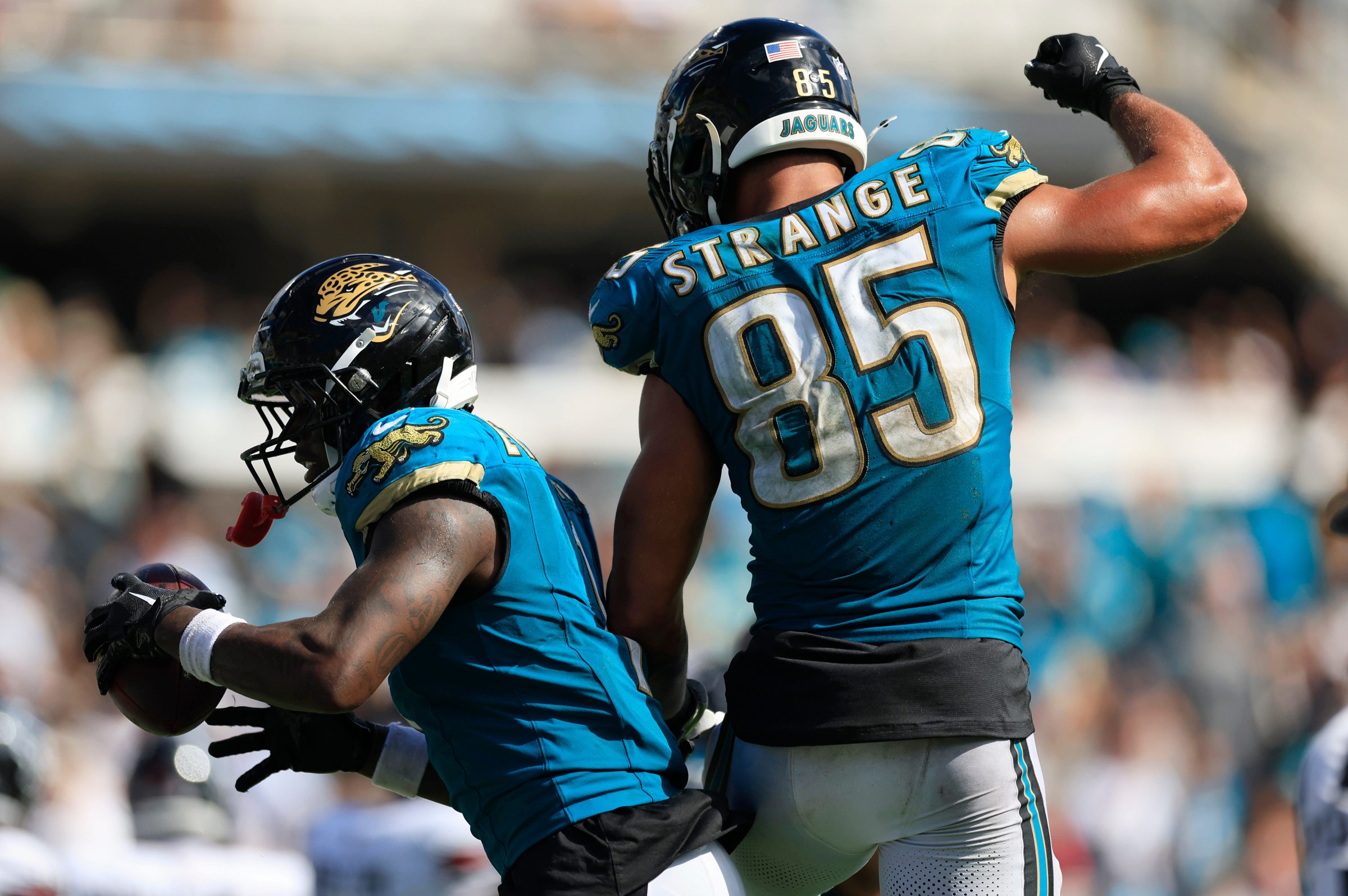 Jacksonville Jaguars running back Travis Etienne (1) celebrates his touchdown with teammate tight end Brenton Strange (85) during the fourth quarter of an NFL football matchup at EverBank Stadium, Sunday, Sept. 21, 2025, in Jacksonville, Fla. The Jaguars defeated the Texans 17-10. [Corey Perrine/Florida Times-Union]