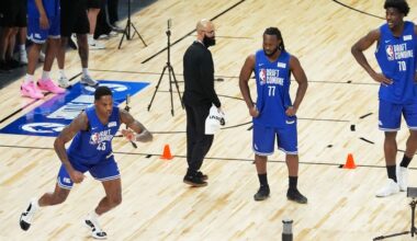 Izaiyah Nelson (43) runs on the court as Bruce Thornton (77) and Rueben Chinyelu (70) watch in the NBA basketball draft combine in Chicago, Monday, May 11, 2026. (AP Photo/Nam Y. Huh)