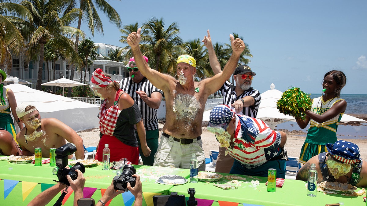 Kevin Renly celebrates after winning the 2026 World Famous Key Lime Pie Eating Championship.