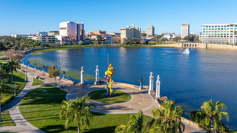 Lakeland boardwalk fronting Lake Mirror, Florida with a city skyline in the backdrop