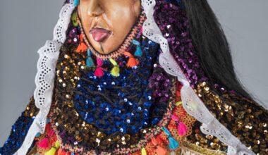 a detail of an elaborate and colorful African masquerade ensemble