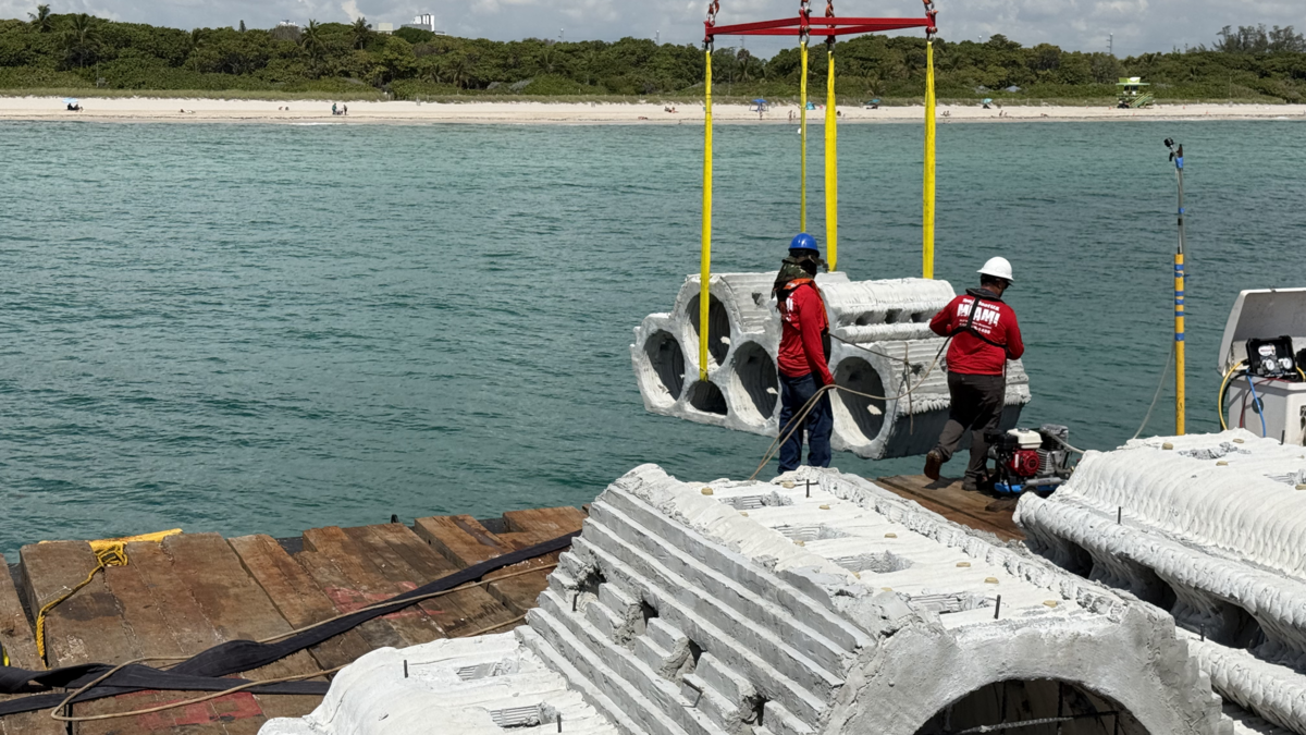 Construction workers ready to sink one of the SEAHIVEs into the waters near Miami Beach. Construction workers ready to sink one of the SEAHIVEs into the waters near Miami Beach.