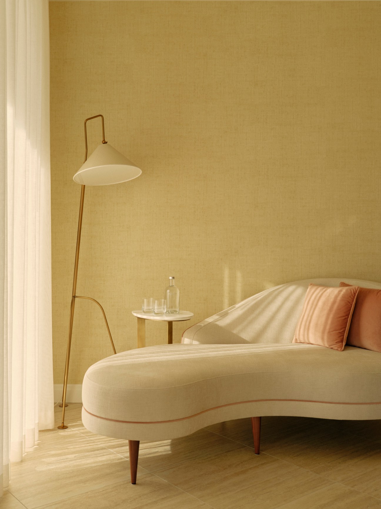 Elegant curved chaise lounge with cream upholstery and orange pillow beside floor lamp in warm-toned hotel room