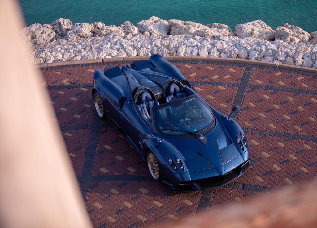 A luxury car by the water
