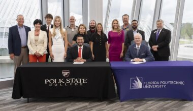 Presidents, Board members and other representatives posing for a group photo.