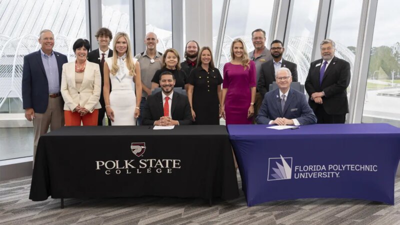 Presidents, Board members and other representatives posing for a group photo.
