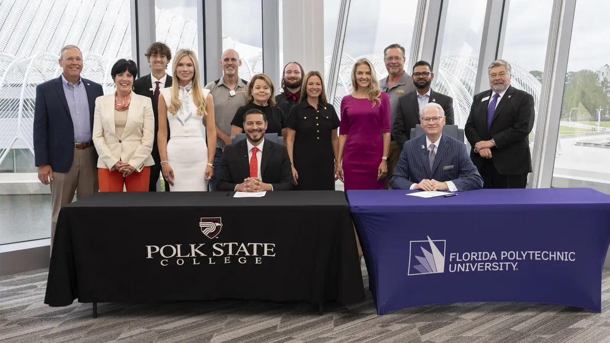 Presidents, Board members and other representatives posing for a group photo.