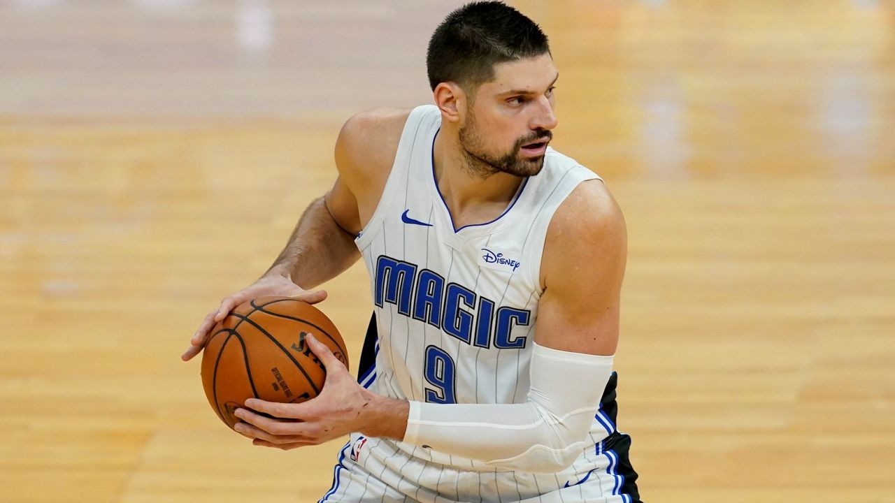Nikola Vucevic (9) looks to pass the ball against the Golden State Warriors on Feb. 11, 2021, not long before he was traded to the Chicago Bulls. (AP Photo/Jeff Chiu)
