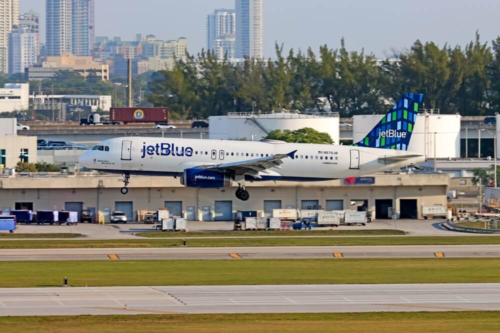 JetBlue plane landing on the runway at Ft Lauderdale Airport
