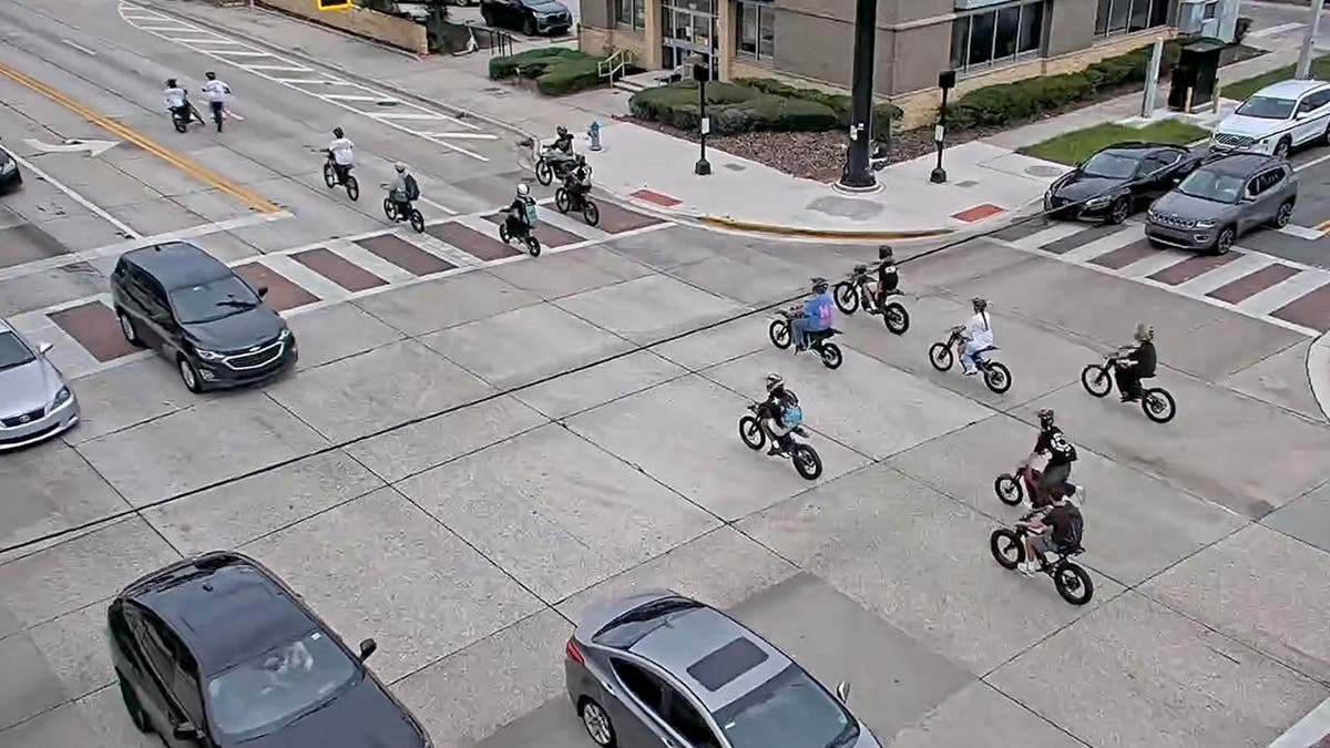 image shows e-bikers in an intersection