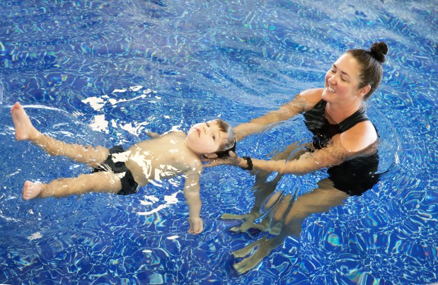 Infant Swimming Resource (ISR) instructor Katie Smith teaches 2-year-old Felix Pisani, of Palm Beach Gardens, how to swim in Palm Beach Gardens on Thursday, July 16, 2026. The swimming lessons are provided through the Live Like Jake foundation, which was started by Keri Morrison after she lost her son, Jake, to drowning. (Carline Jean/South Florida Sun Sentinel)