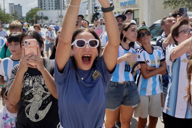 Fans cheer outside The Dalmar Hotel in Fort Lauderdale as the Argentine team leaves the hotel for their World Cup match on Friday, July 3, 2026. (Mike Stocker/South Florida Sun Sentinel)