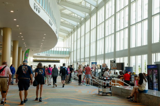 Attendees at the AAU Girls' Junior National Volleyball Championships at the Orange County Convention Center in Orlando make their way through the concourse on Monday, June 29, 2026. (Rich Pope/Orlando Sentinel)
