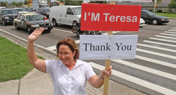 Teresa Jacobs say's thank you to motorists Aug. 25, 2010 at the corner of SR 436 and Curryford Rd. Jacobs won 42 percent of the vote in primaries of the Orange County mayor's race. There will be a runoff election Nov. 2 with Bill Segal. (Orlando Sentinel file)