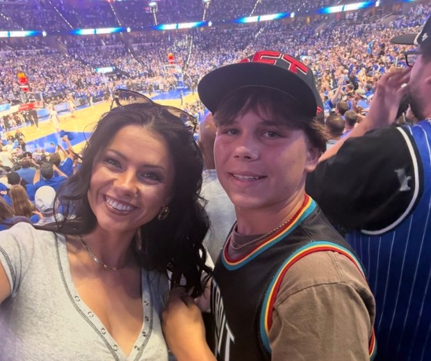 Orlando mom Ashley LaChance snapped a selfie of herself with 13-year-old son Colton Remsburg at an Orlando Magic-Detroit Pistons playoff basketball game in April at The KIA Center. Colton, born in Michigan, wore a Pistons jersey. He died about two weeks later when a pickup truck hit the e-scooter he was riding to a store near Lake Nona to buy a Mothers Day flower bouquet for his mom. (Ashley LaChance)