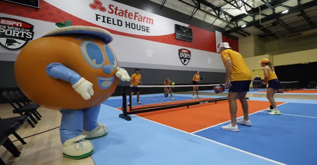 Orlando Squeeze mascot Lil' Squeezy makes an appearance during a Major League Pickleball practice Wednesday at the ESPN Wide World of Sports Complex. (Ricardo Ramirez Buxeda/ Orlando Sentinel)